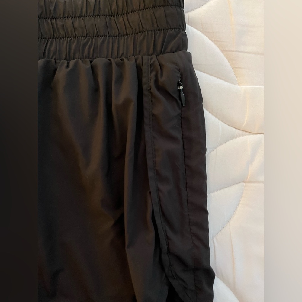 High waisted athletic shorts with brief liner and zip pocket